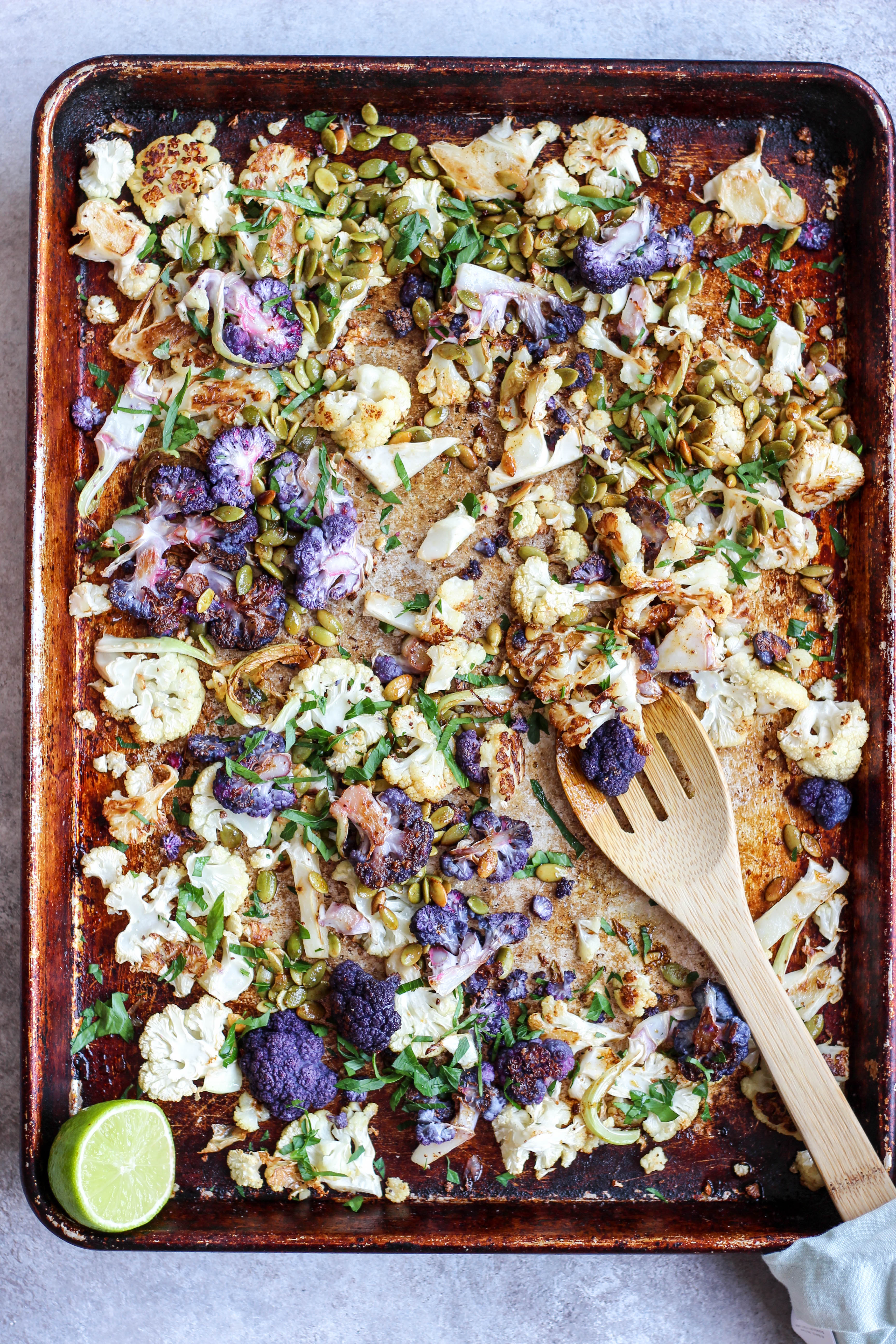 Roasted Cauliflower with herbs, toasted pepitas, and lime